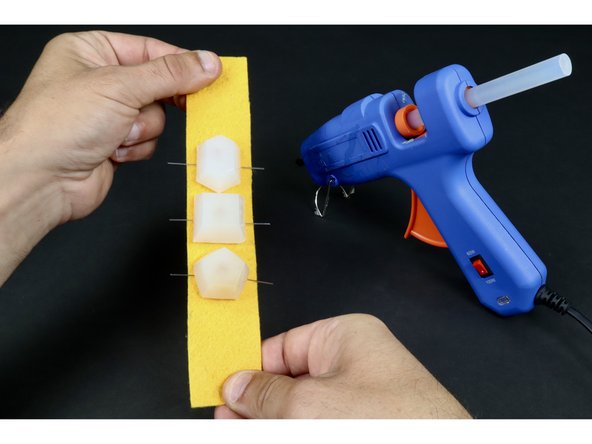 Repeat this process for the remaining two LED jewels taking care to keep all short LED legs on one side of the felt and all the long legs on the opposite side.  