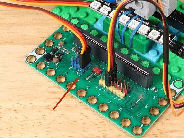 The Blue Pins on the Bit Board provide extra power (5 volts instead of 3 volts) by boosting the voltage coming from the battery pack. This helps improve servo performance, especially with multiple servos.