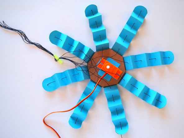 Repeat this 7 more times until all 8 pieces of thread are sewn into the straw