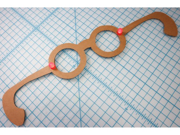 With the circuit connected, it should light up! Check that both LEDs are illuminated, and if not, check the circuit connections on each side.