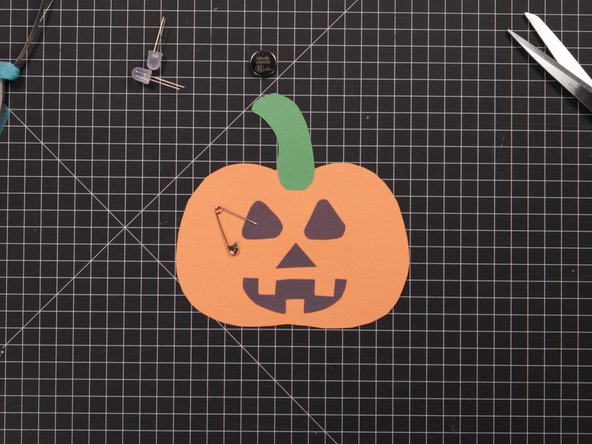 Use a safety pin or a thumbtack to poke holes for the LED legs to go through.