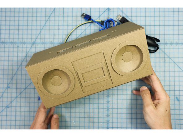 Glue the top of the box to the front and back with Super Glue