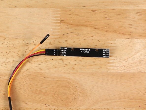 If you turn the NeoPixel Strip over you'll see labels for the three pins. You should see IN, VCC, and GND.