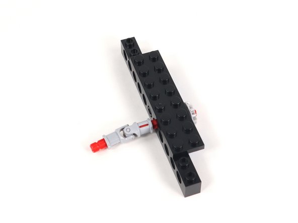 Insert a 2-stud long axle into the other end of the universal joint.