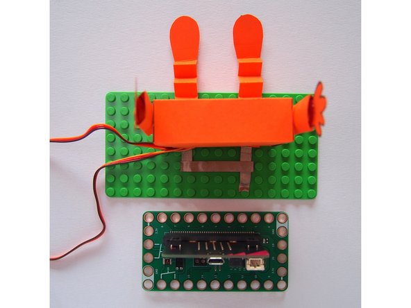 Add another piece of Maker Tape that connects the two leg tabs.