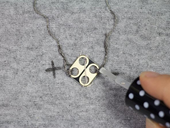 Turn the shirt inside-out. Place clear nail polish or super glue over the knots where shown, to keep the circuit working for a long time!