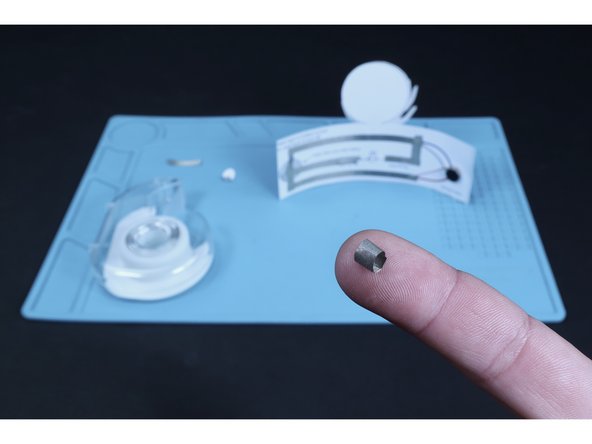 Make a tape loop out of Maker Tape and press it atop the paths that cross the battery graphic on the diagram.