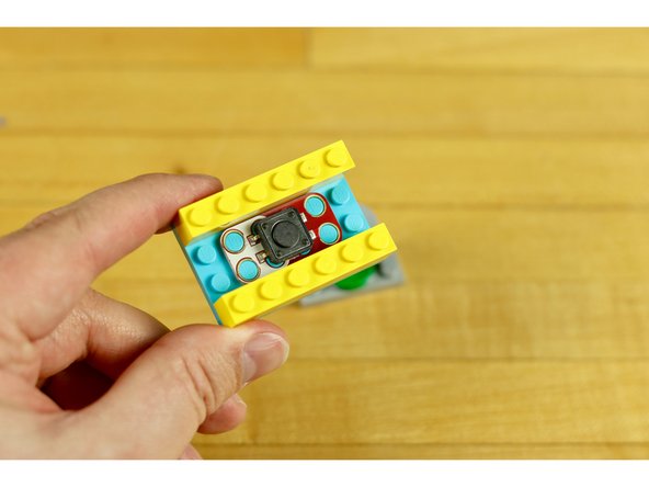 Just place your plate over the top of the switch so the axle makes contact with the button.