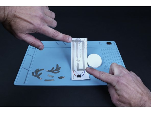 Peel and stick the two smaller pieces shown in photo 3.