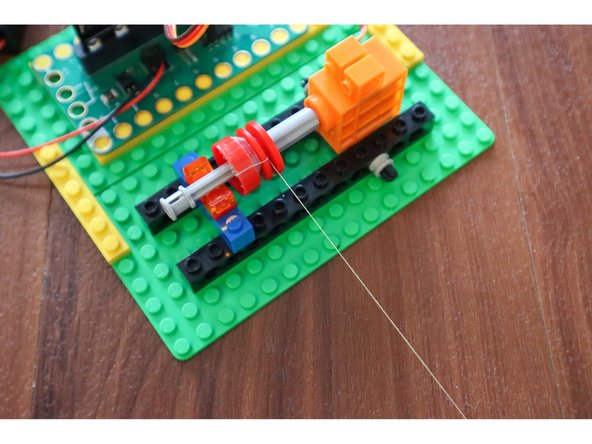 Place the assembly on top of the motor head.