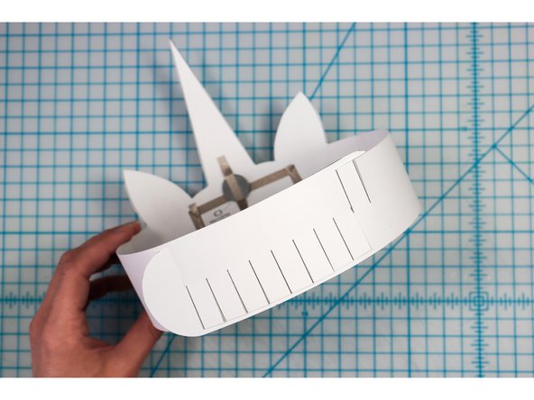 Interlock the slits in two places to create the size that works for your head.