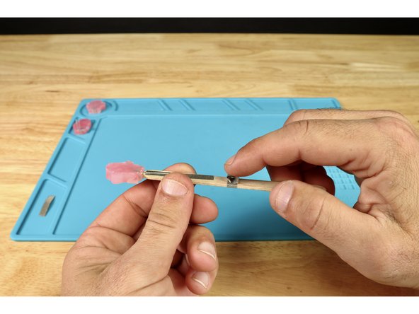 Stick that tape loop where shown in photo 2. This should be atop the last path you wrapped from front to back.