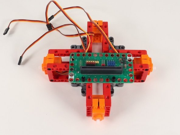 Add the Bit Board onto the black pins with pins 0-8 on the Bit Board facing you.