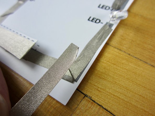 Overlap tape with the tape coming from your negative LED leg.