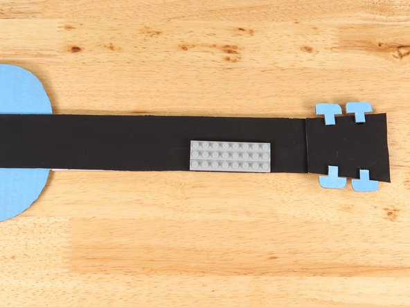 Remove the extra LEGO plate holding the other plates together.