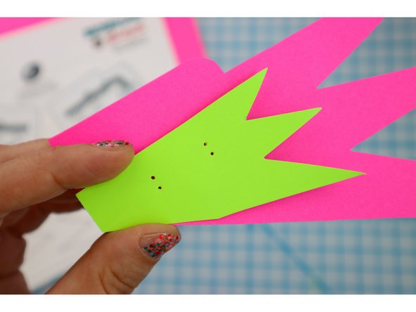 Glue the two pieces together, aligning the holes.