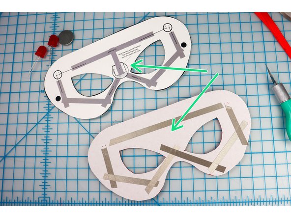 Using the template as a guide, add Maker Tape to the mask as shown, except for the piece at the center -- that will be added in the next step.
