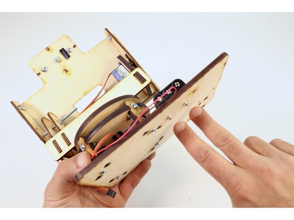 Secure the battery pack by tightening the two M3 nuts to the screws with your screwdriver.