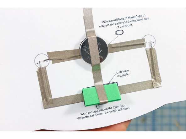 Thread the LEDs through the holes, paying attention to the + and - notations.