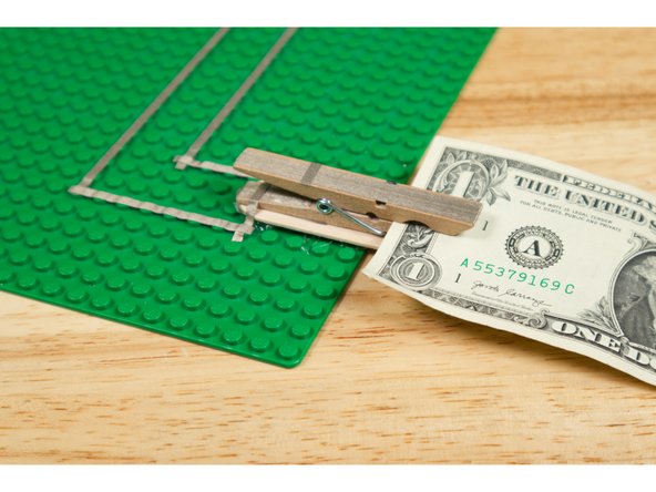 Place an insulator (a card or a dollar bill) in the clothespin switch to disable the switch.