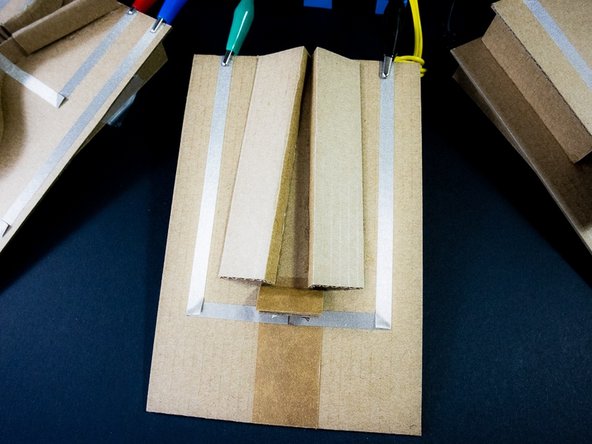 Using alligator clips, connect one side of each switch to ground, and the other to pin 0, 1, 2, and/or 3. In the example code, we connected all of the switches at once.