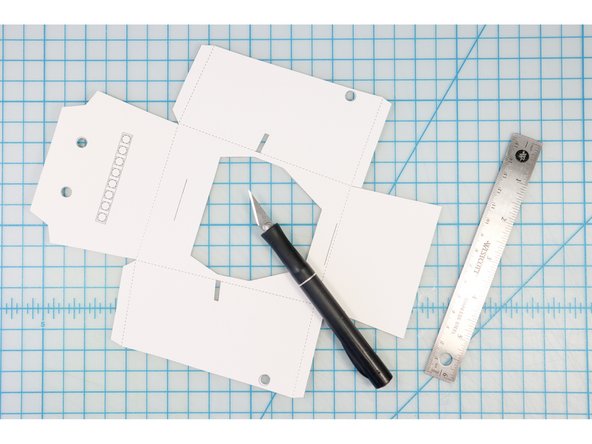 Use a craft knife and ruler to cut the interior shapes and lines.