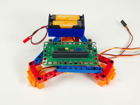 The other pin will go into the end of the yellow 3 hole beam.