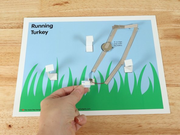 Add a square of double-sided foam tape onto the shaft of the motor, and then stick the legs to it.
