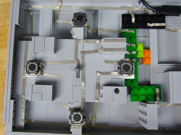 Connect each of the D Pad buttons to the Invention Board.