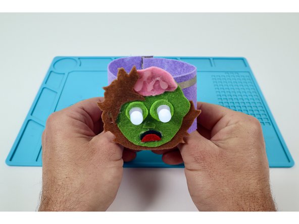 To complete the circuit and turn the LEDs on, simply connect the two pieces of hook and loop.