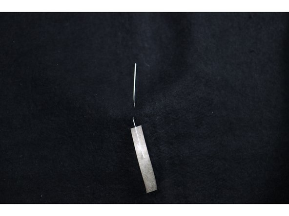 Make the LED legs easier to connect by wrapping about 1 inch of Maker Tape around each leg as shown.