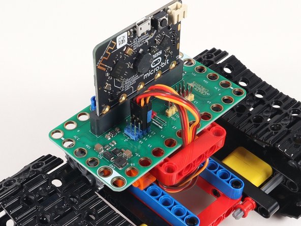 Remember when we added a piece of tape to the left servo in Step 20? This is where it comes in handy!