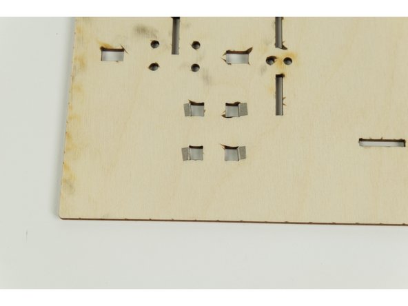The holes create a gap in the circuit that we'll close using switches we'll make in Step 19.