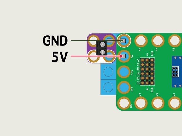 The positive (red) wire from the battery pack should align with the 5V Pin on the Robotics Board. The black (negative) wire from the battery pack should align with the GND Pin on the Robotics Board.