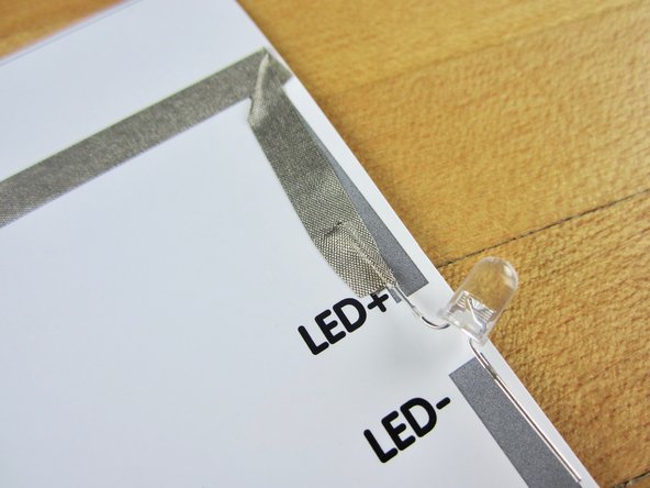 Overlap a new piece of tape with the diode leg/ positive battery wire tape.