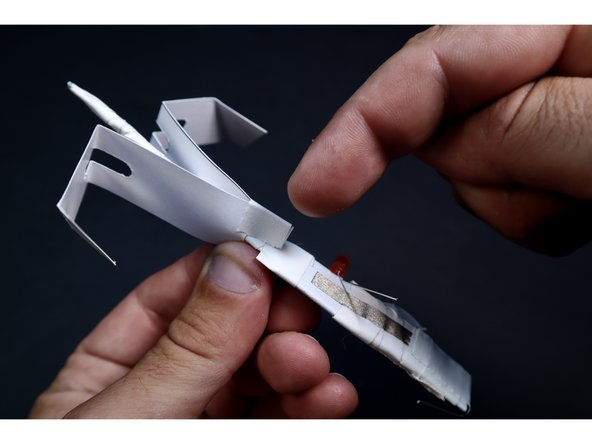 Use the two tape pieces to cinch together the sides of the Rotor Blade around the narrow shaft.