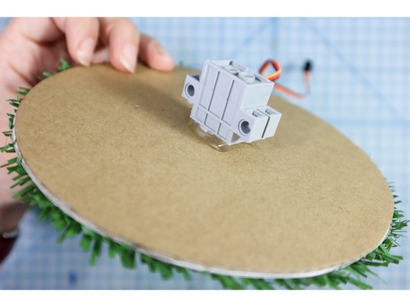 Use hot-glue to secure the motor to the back of the eye.