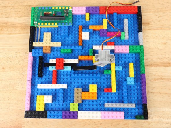 Fill the LEGO baseplate with bricks to create a maze.
