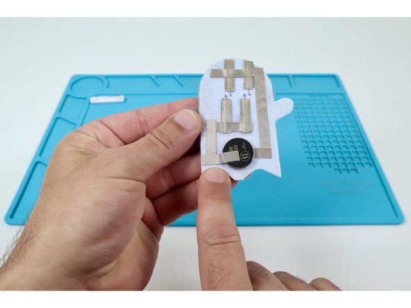 The second path should overlap the first and go down the left side of the felt embellishment.