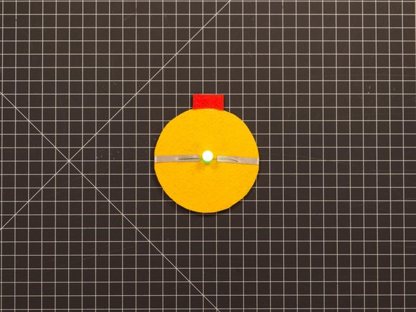 The glue stick takes a while to dry, so once you stick it down be careful not to let the felt piece move around. (You could help it stay in place with a few small pieces of blue painter's tape.)