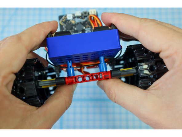 Place the battery pack over the pins with the batteries facing up.