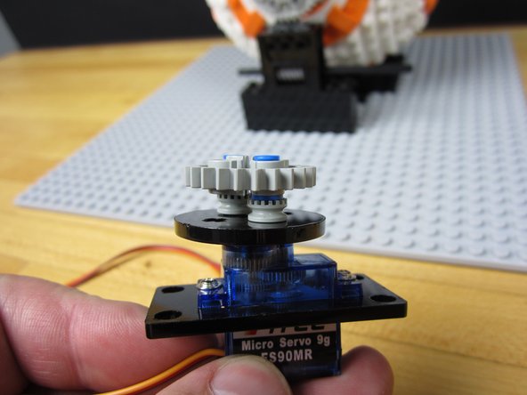 Attach the laser cut Crazy Circuits adaptors to the 9G sized servo.