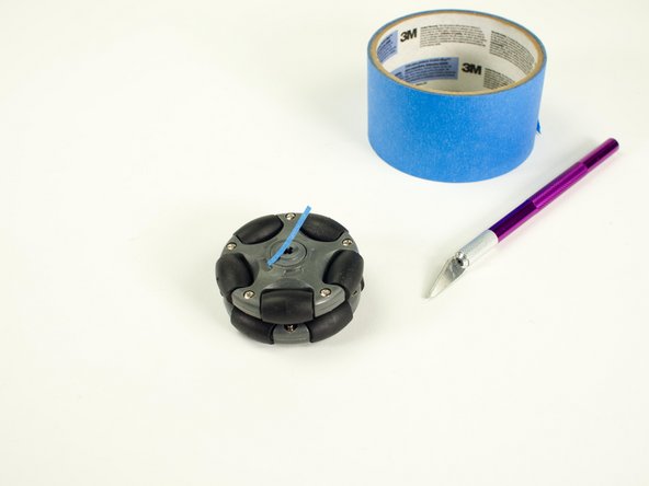 While the LEGO axle hubs are too loose to attach to the servo axle, there is a quick fix you can use. (And no, it's not hot glue!)