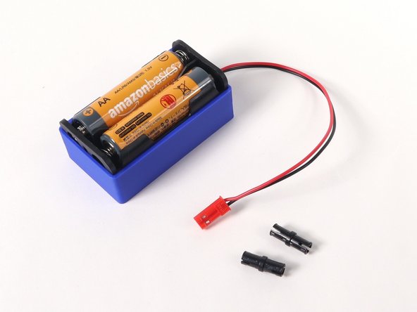 You'll need two pins to attach the battery holder.