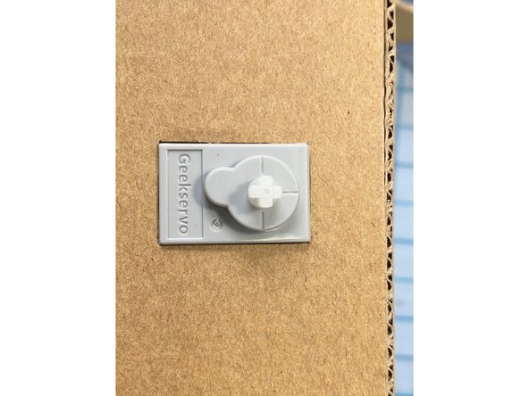 On the right side, we cut out a place for the servo to attach to the moving arm.