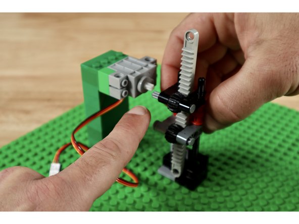 Note: Add one more 1x3 cross block with 2 axle holes on top. It is pictured in slide 1 but not the remainder as this was an improvement made after the other photos were taken.