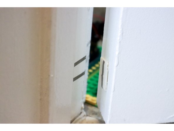 Add another piece of tape on the door to close the switch when the door is closed.