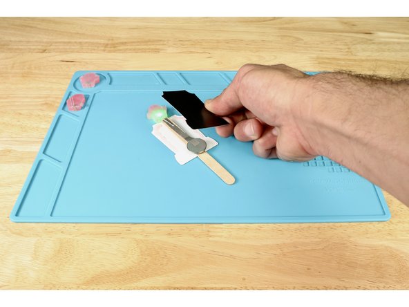 Squeeze hot glue where shown in photo 1.