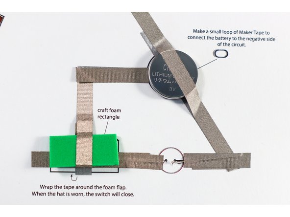 Add another piece of Maker Tape on top of the LED's legs as shown.