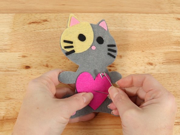 Use a safety pin or a push pin to poke two holes through the felt for the LED legs to go through.